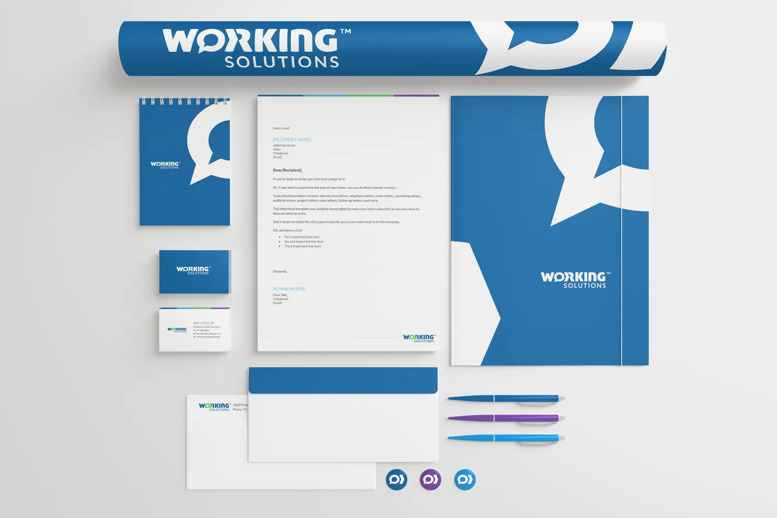 New stationery: poster tube, notepad, business cards, letterhead, pocket folder, envelopes, pens and icon buttons, in Working Blue with a large speech-bubble graphic