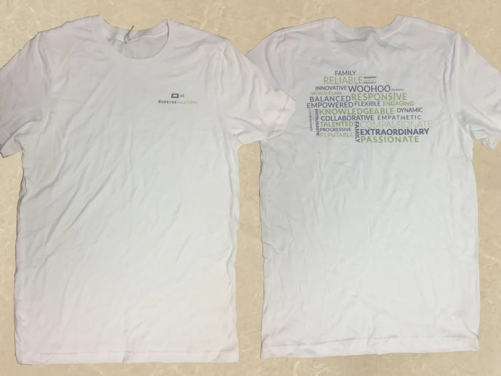 White t-shirt with the old logo on the front and a word cloud of company values on the back